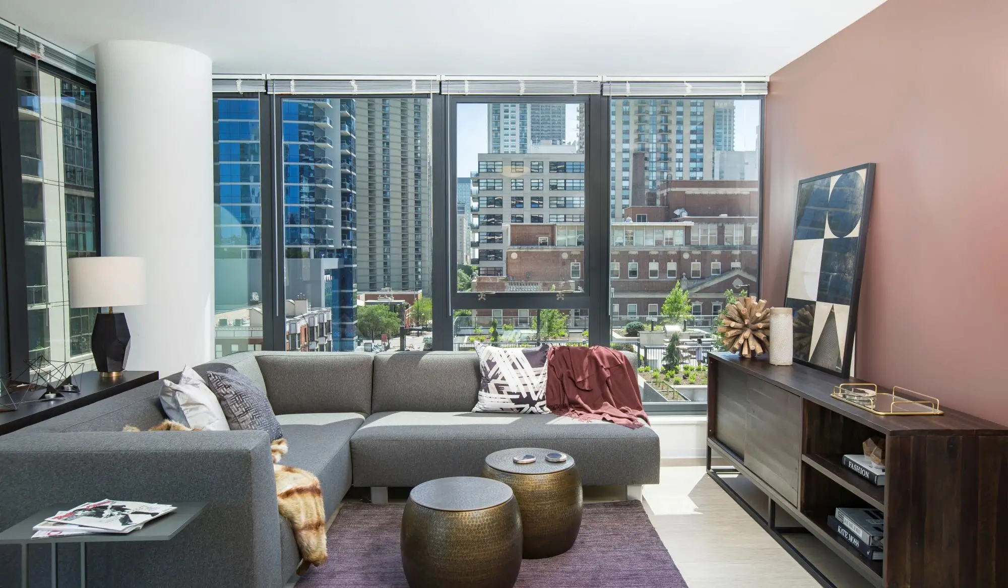 Beautiful living room with large windows at Exhibit On Superior in Chicago, Illinois
